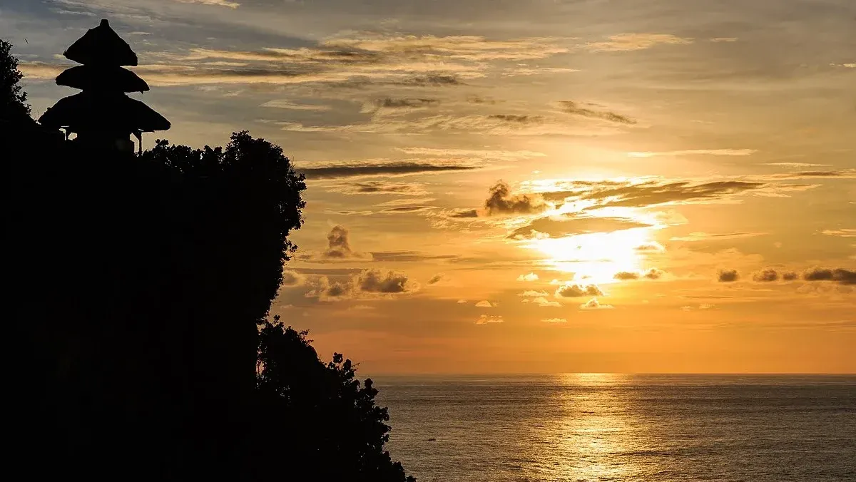 Uluwatu Temple on the cliff at sunset